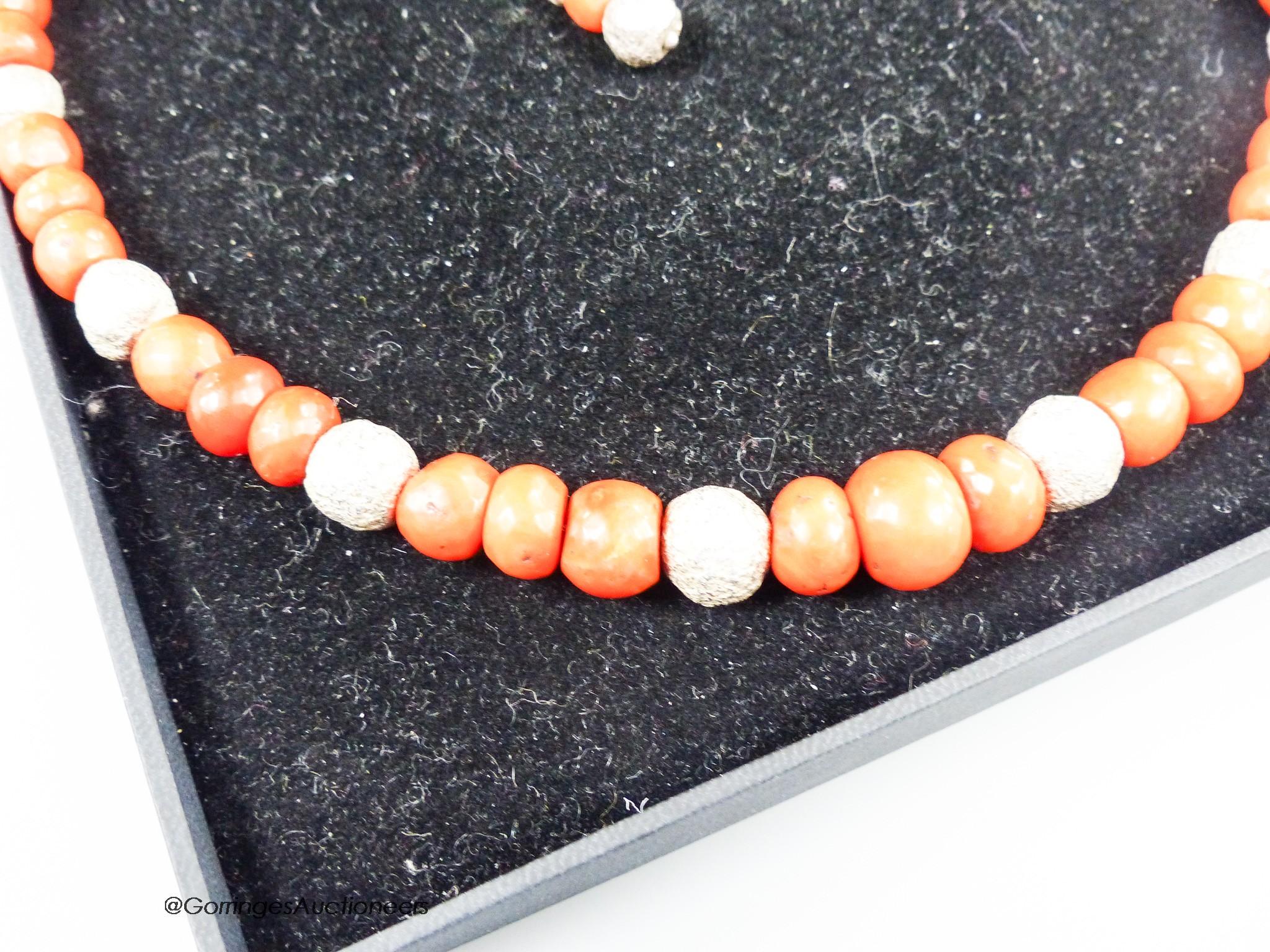 A modern Pruden Smith coral and white metal bead necklace, approx. 42cm and a pair of matching drop earrings